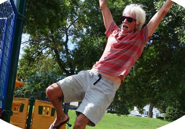 Stephen Jepson hanging on monkey bars