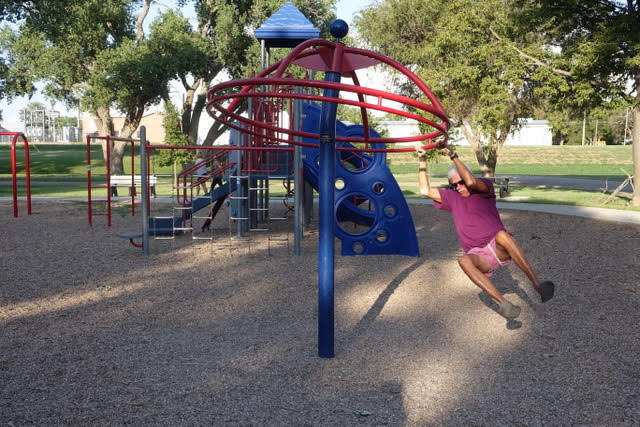 Stephen on playground merry-go-round